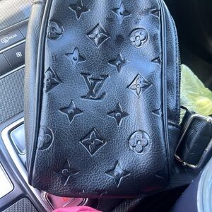 SOLD  Louis Vuitton Black Embossed Monogram Sling Bag